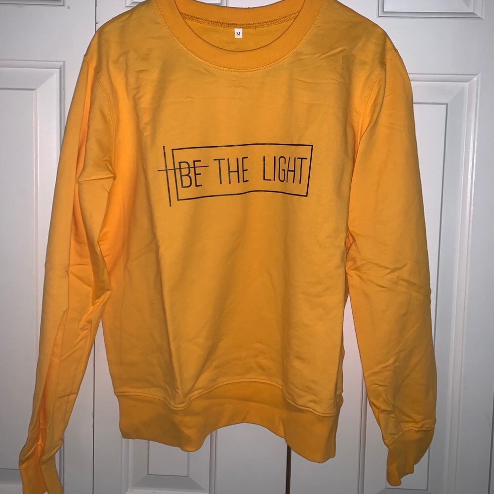 “Be the light” yellow-gold sweatshirt